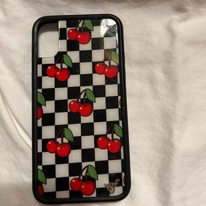 Wildflower case with black and white checkered case with red cherries